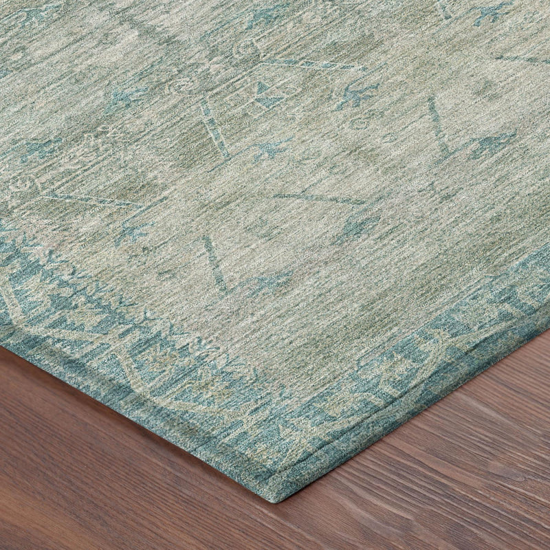 Teal blue and pewter tribal area rug corner with woven edge on indoor flooring