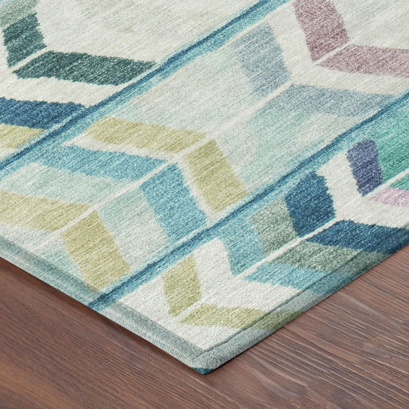 Multicolor geometric tribal area rug in teal, turquoise, and cream, shown from corner.