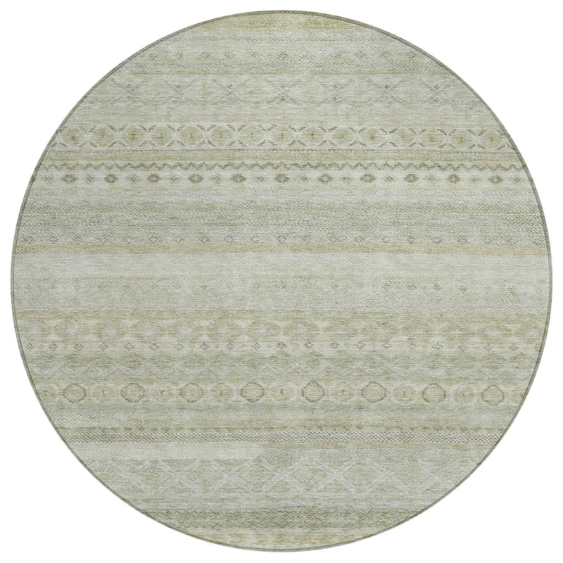 Round area rug with light green center and beige horizontal stripe and medallion accents