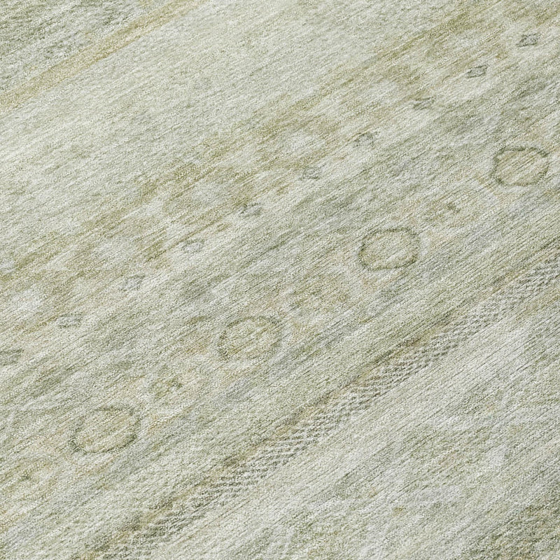 Close-up of round area rug surface in light green with subtle circular motifs