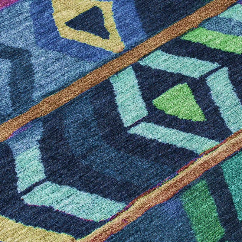 Blue-toned tribal pattern area rug with multicolor squares and borders, flat woven texture