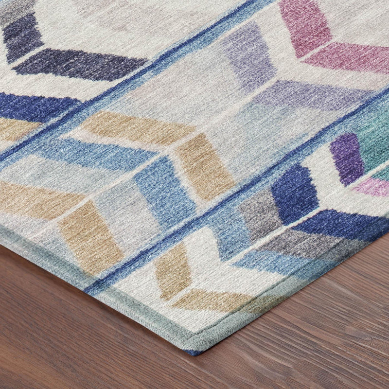 Light blue tribal area rug with beige, navy, and purple geometric motifs