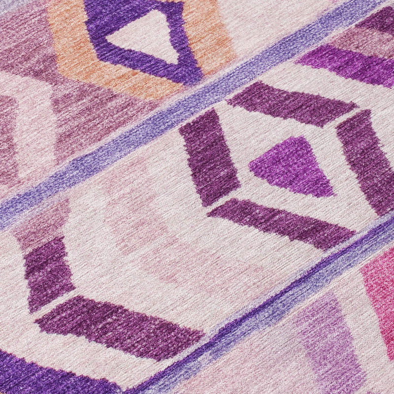 Diagonal close-up of purple and lavender geometric tribal rug with diamond shapes