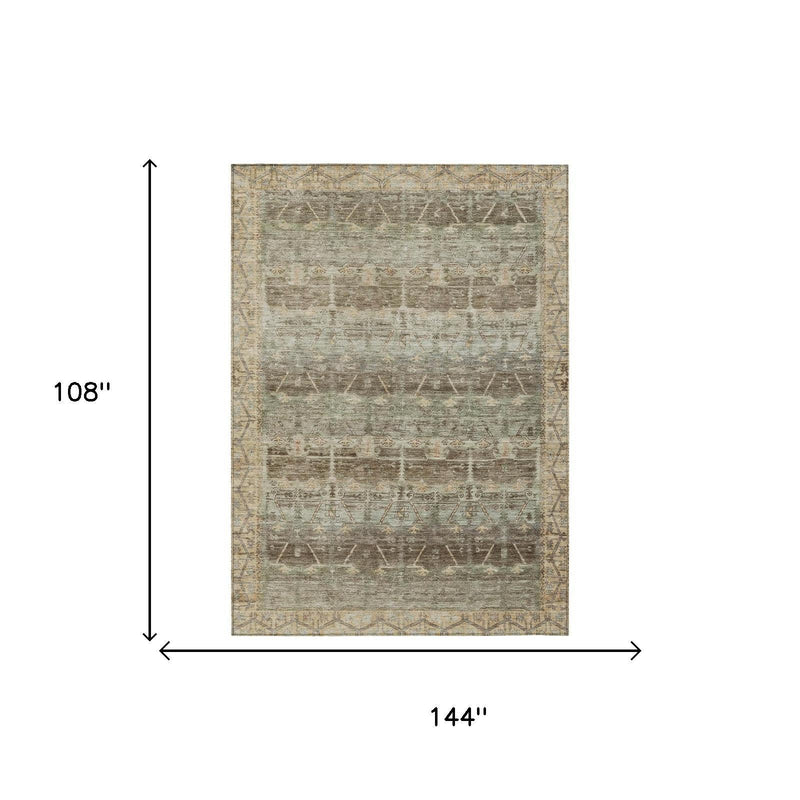 Flat-lay distressed tribal area rug, light beige with muted green and brown pattern.
