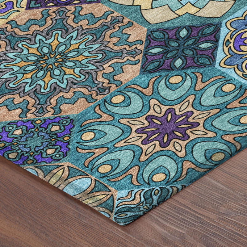 Rug corner with detailed teal swirls and floral motifs, plus purple and tan accents
