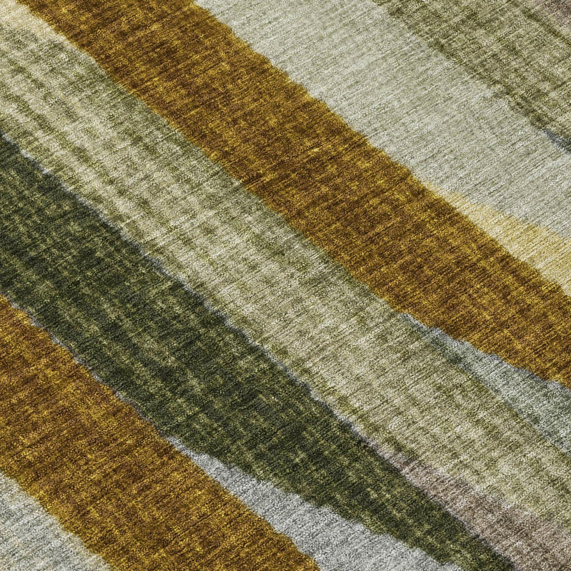 Washable area rug close-up with wide vertical bands in gray, green, cream, and gold