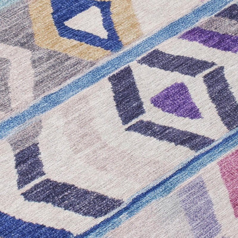 Close-up of multicolor tribal rug with blue edge trim and geometric squares and diamonds