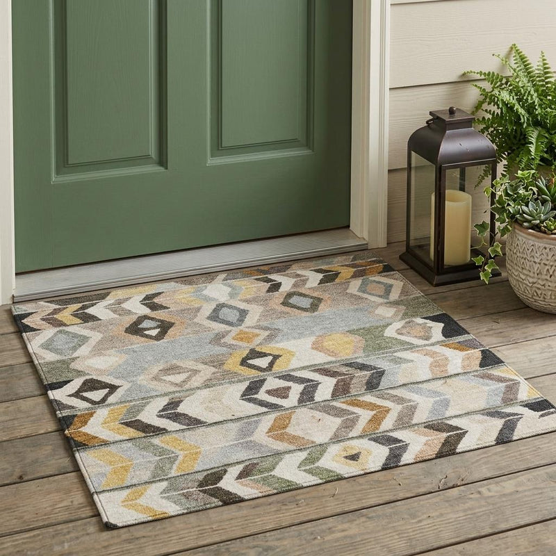 Geometric tribal area rug featuring diamond and arrow shapes in light beige and gray