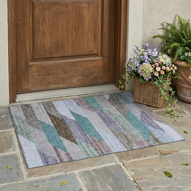 Striped area rug with vertical wave stripes in gray, brown, teal, and blue