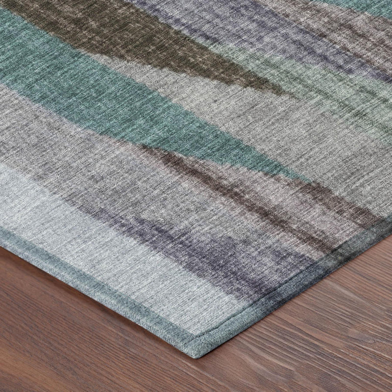 Striped area rug corner with gray ground and teal, brown, and blue banded stripes