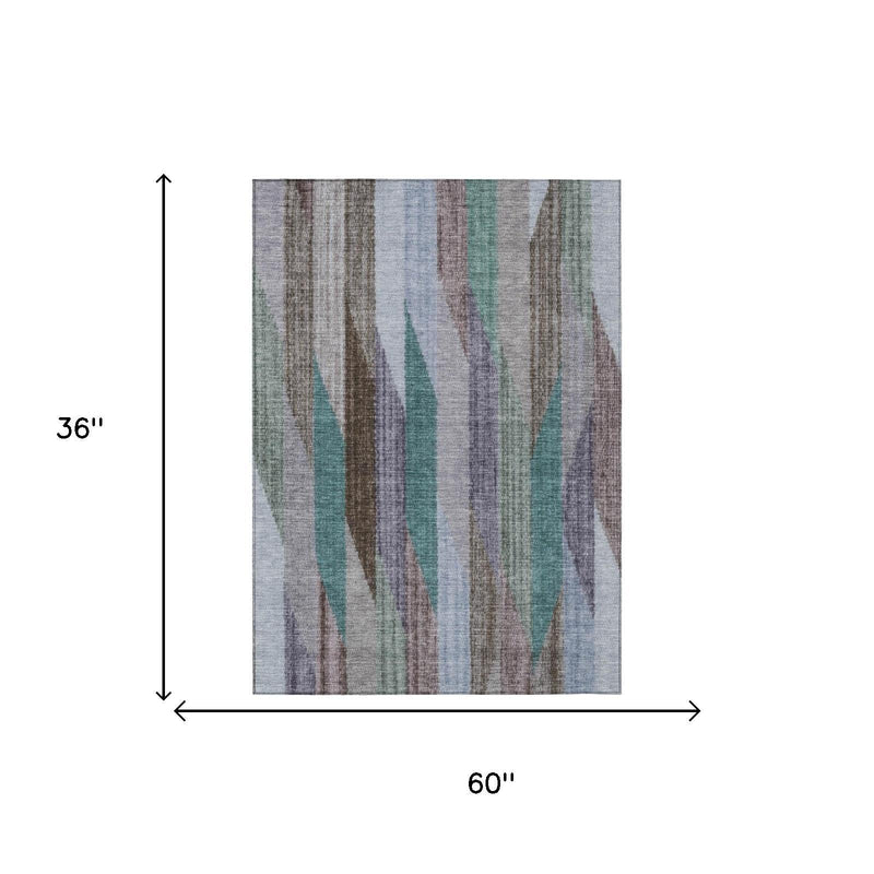 Striped area rug, gray with brown, teal, and blue vertical wave stripes; rectangular