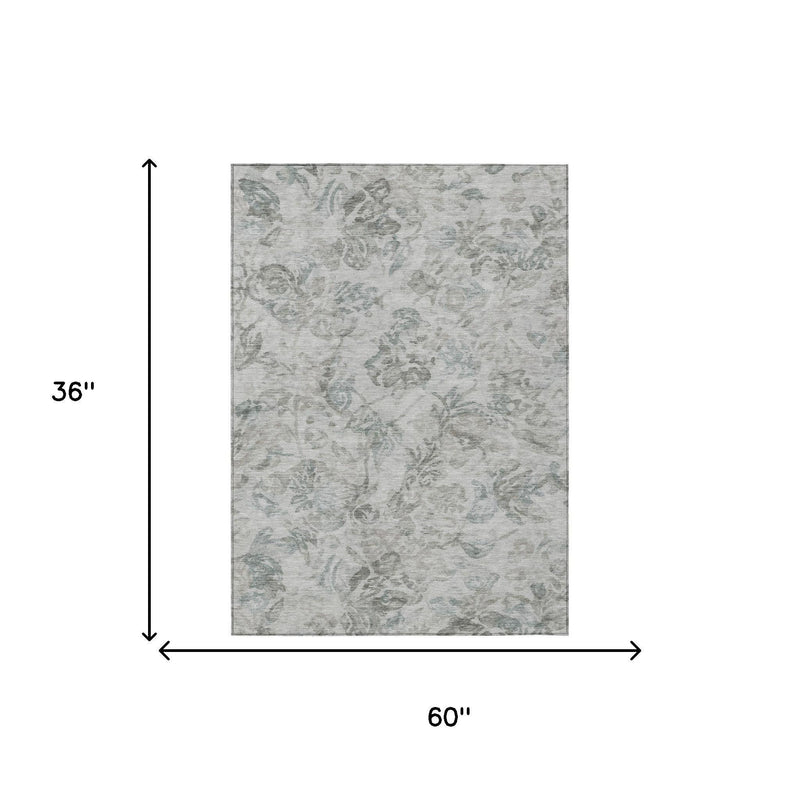 Rectangular area rug, light taupe with teal floral motifs; 60 x 36 in