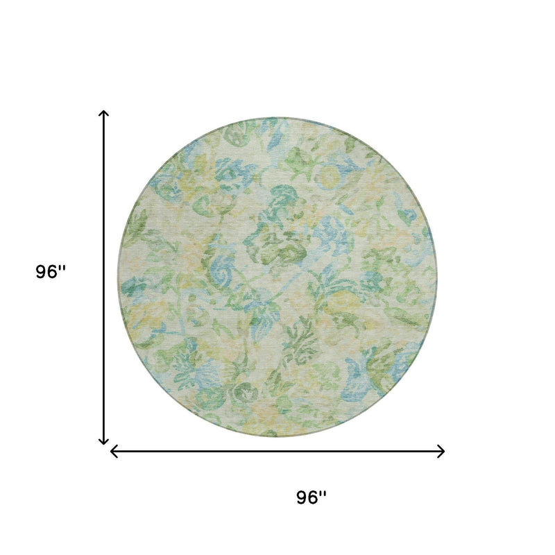 Round area rug, light cream base with blue and green floral motifs