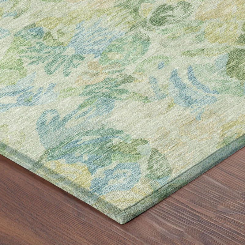 Close corner view of round rug with multicolor floral print and flat weave edge