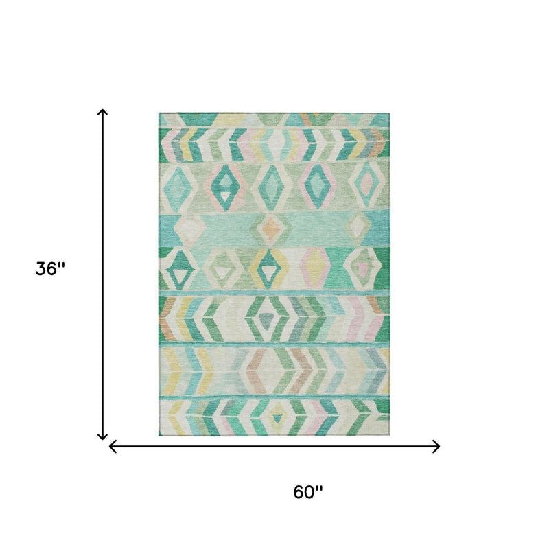 Turquoise and teal tribal geometric area rug shown in full with cream border (60 x 36 in)