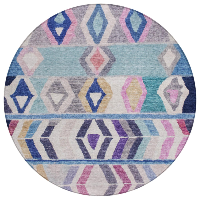 Round area rug close-up with geometric tribal diamonds and horizontal stripes in blue, gray, pink