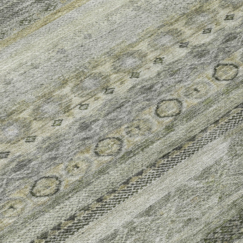 Close-up of gray and pewter striped washable area rug with small motif accents