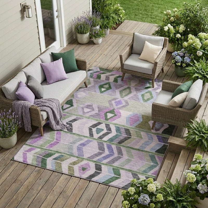 Geometric tribal area rug with lavender, green, and gray chevron and diamond pattern
