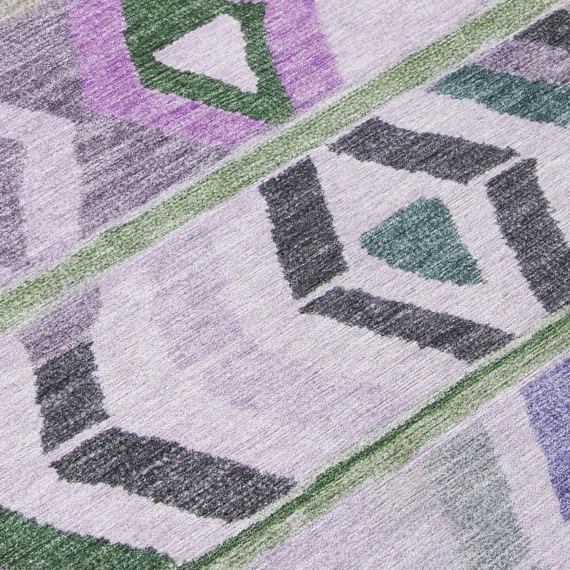 Corner detail of tribal area rug with lavender, green, and gray geometric blocks