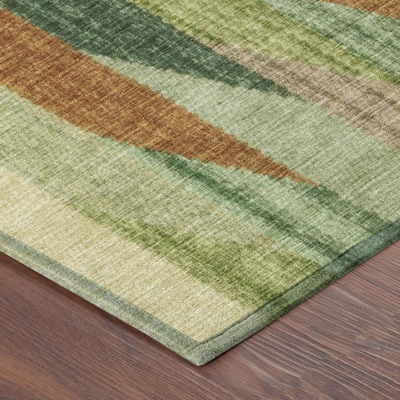 Corner view of round area rug with green, brown, and cream striped weave