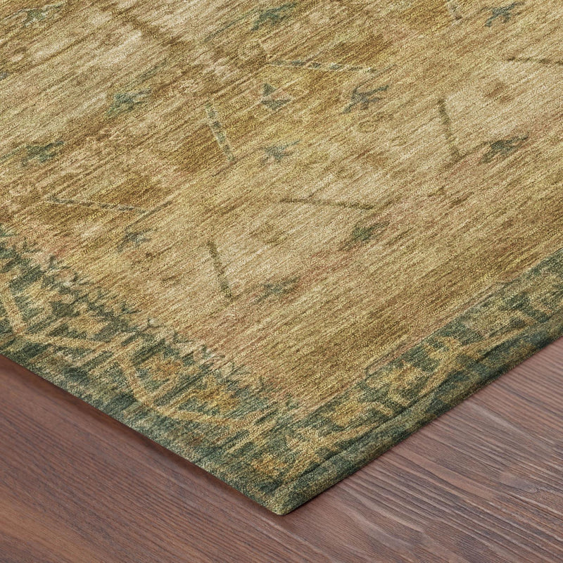 Close-up corner of beige rug with teal geometric border and worn texture