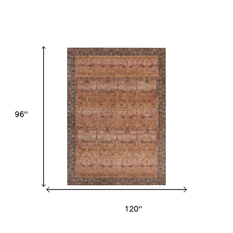 8 x 10 ft rust-orange tribal area rug with blue motifs and distressed finish.