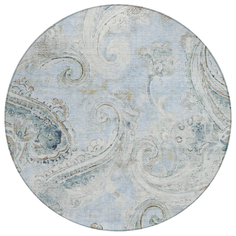 Round area rug with sky blue base and blue paisley medallion, distressed finish