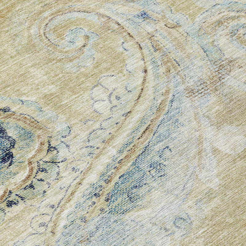 Wheat area rug with blue paisley scrolls and swirls, close-up