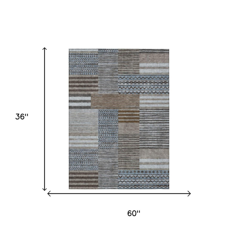 Patchwork area rug with striped blocks; 60 in x 36 in size shown