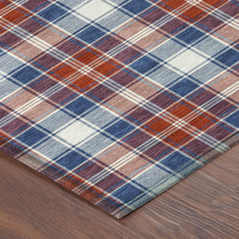 Rectangular plaid area rug corner with blue, ivory, and rust/red crosshatch