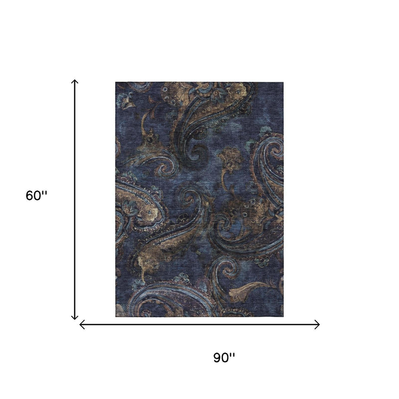 Navy blue paisley area rug, 90 in by 60 in, blue and tan scroll pattern