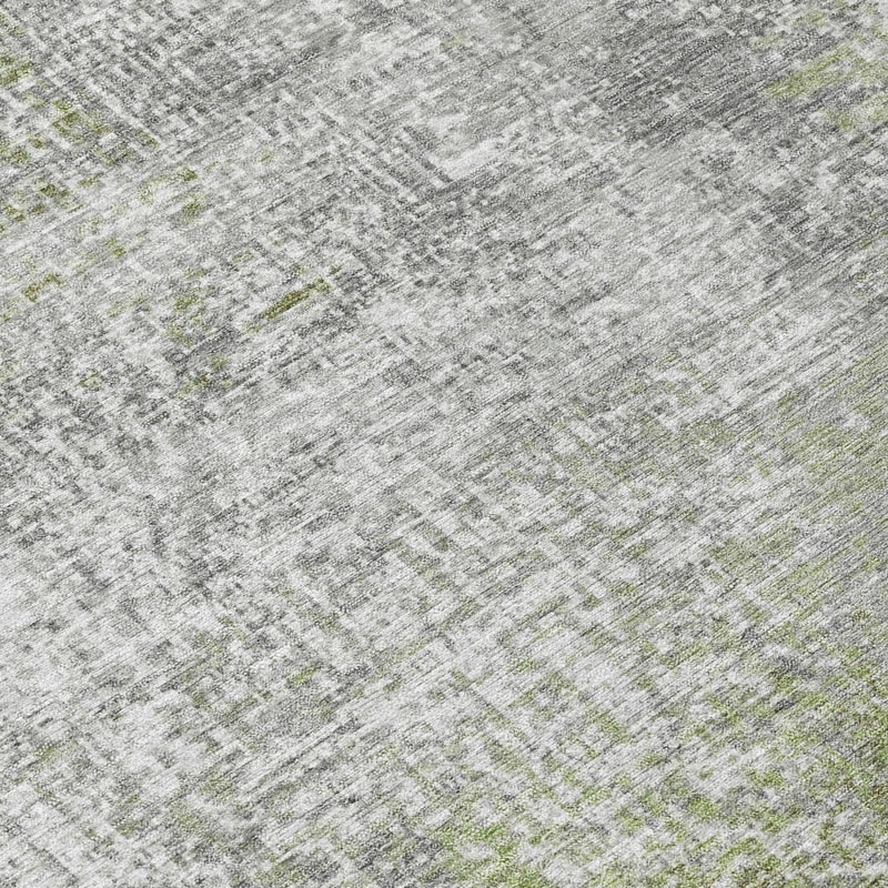 Close-up of green-gray abstract area rug weave with distressed washed pattern