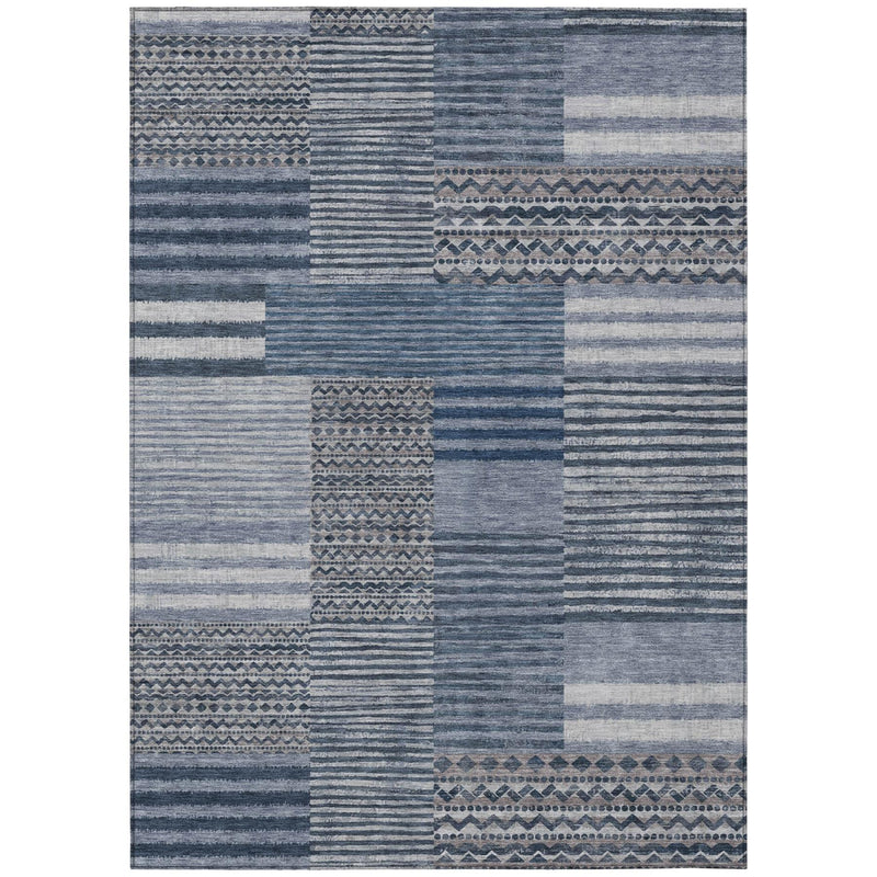 Blue and gray patchwork area rug with striped blocks and decorative border pattern