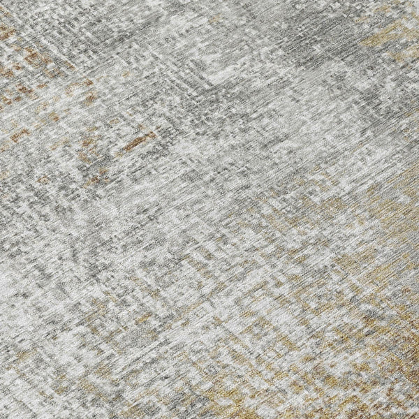 Abstract area rug with gray base and muted khaki wash texture, close-up