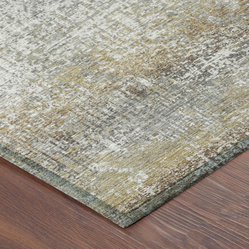 Corner detail of gray and khaki abstract area rug with distressed, woven texture