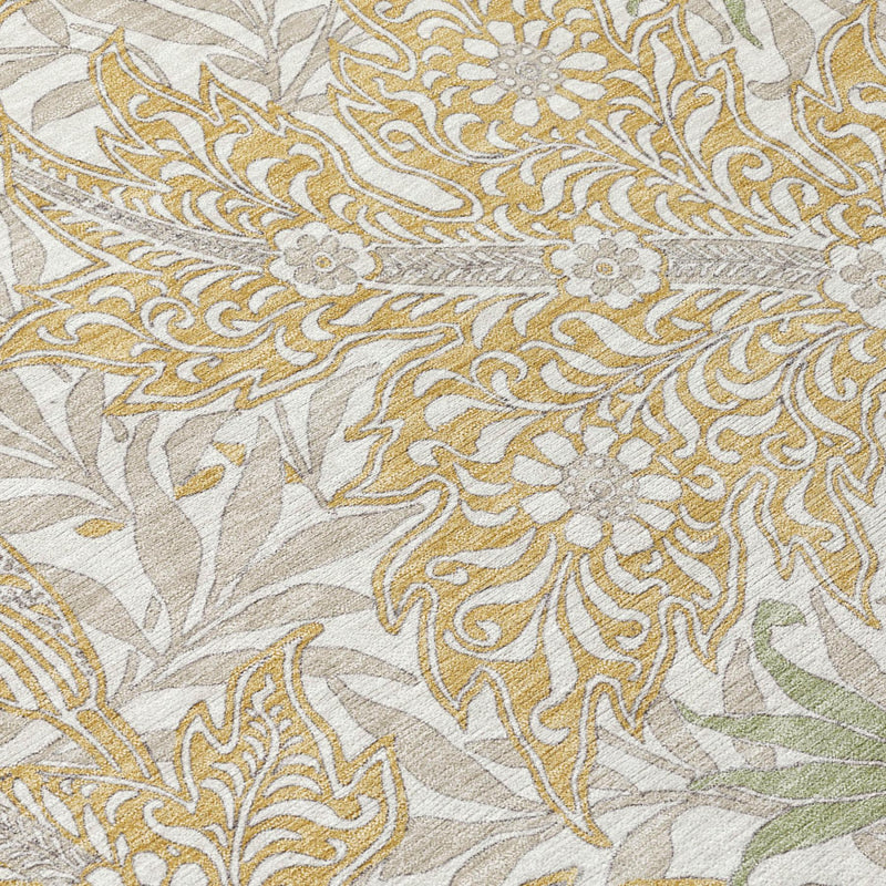 Washable area rug close-up of gold and silver botanical leaves on light background