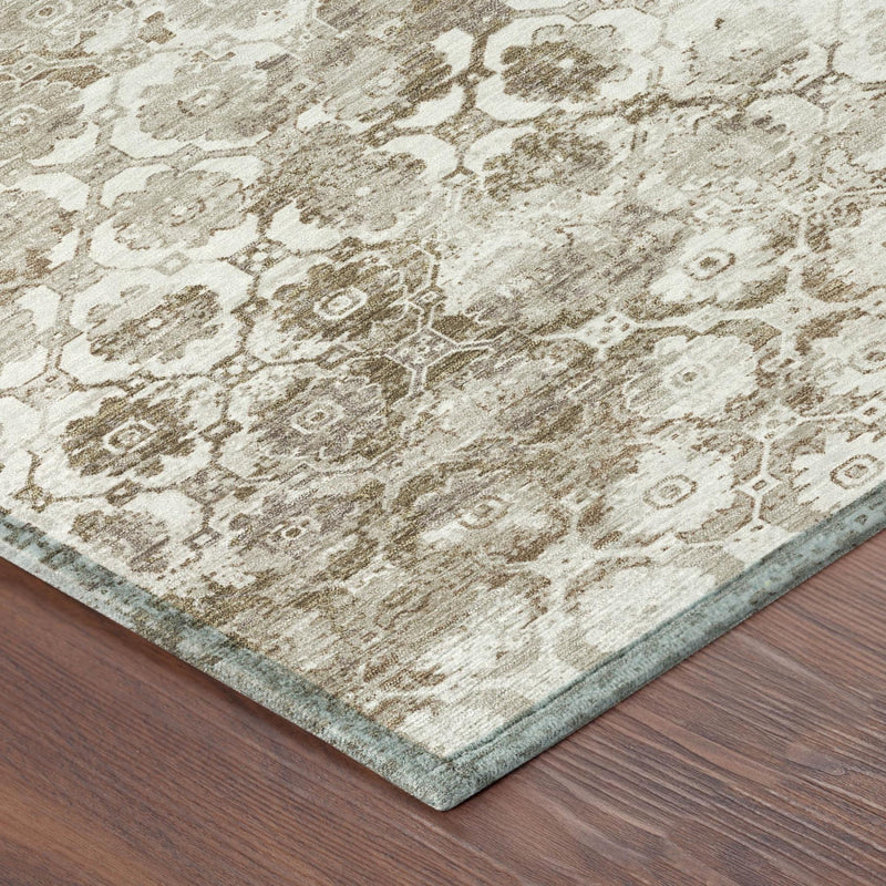 Beige and brown floral medallion area rug corner with thin border and distressed texture