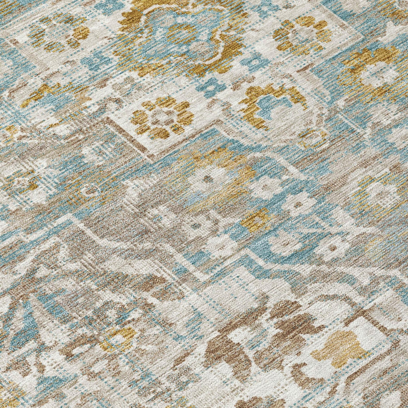 Close-up floral medallion area rug in ivory, blue, and pewter with distressed lines