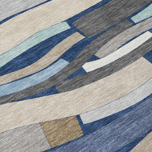 Round area rug with geometric striped pattern in navy, blue, and beige