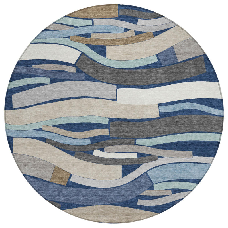 Round rug with abstract geometric stripe pattern in blues and beige