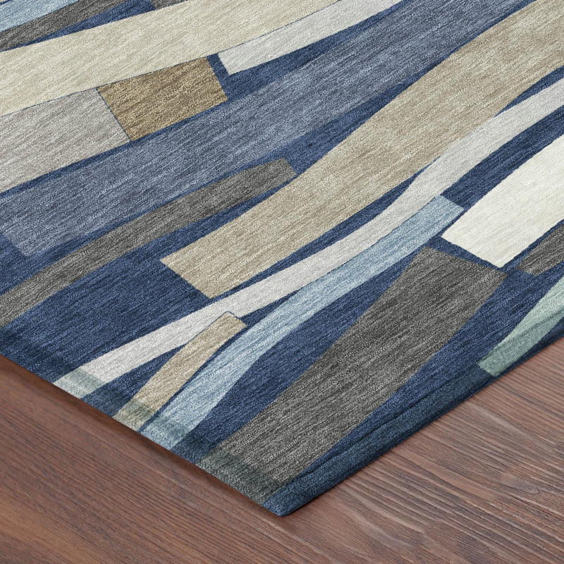 Corner view rug with navy, blue, white, and beige geometric stripe pattern