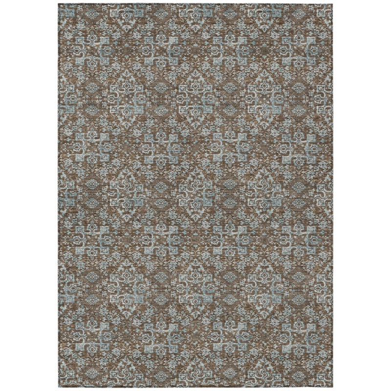 Damask area rug flat lay with tan, brown, and teal repeating geometric motifs