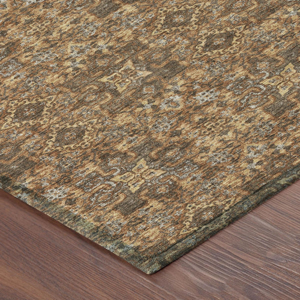 Orange and brown damask-pattern area rug with textured distressed look