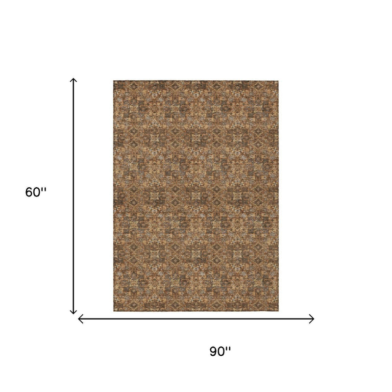 Damask area rug in brown and orange, shown with dimensions 60" x 90"