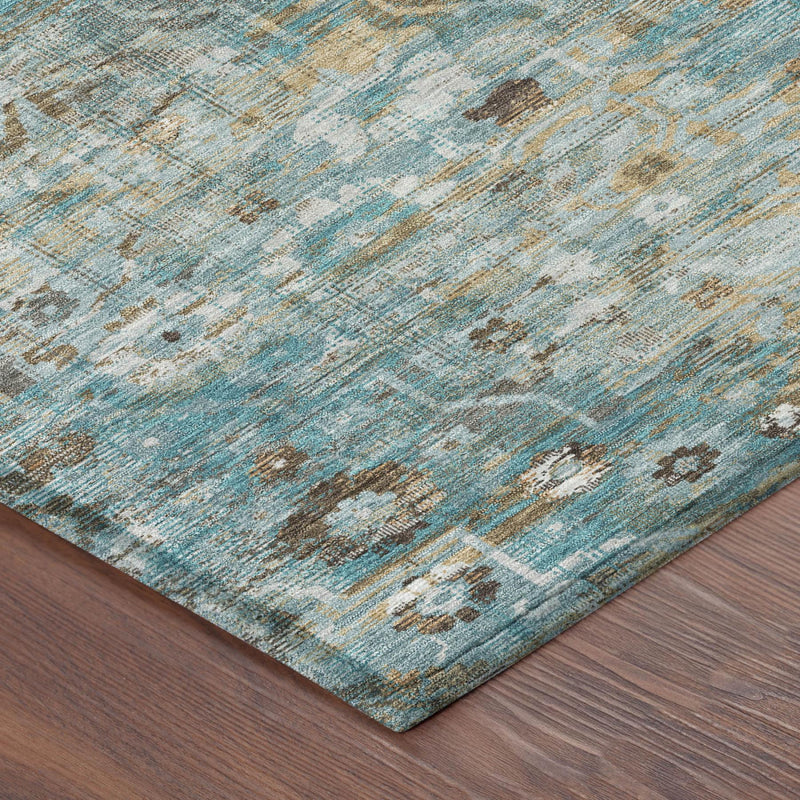 Teal blue and pewter floral medallion washable area rug corner detail on wood floor