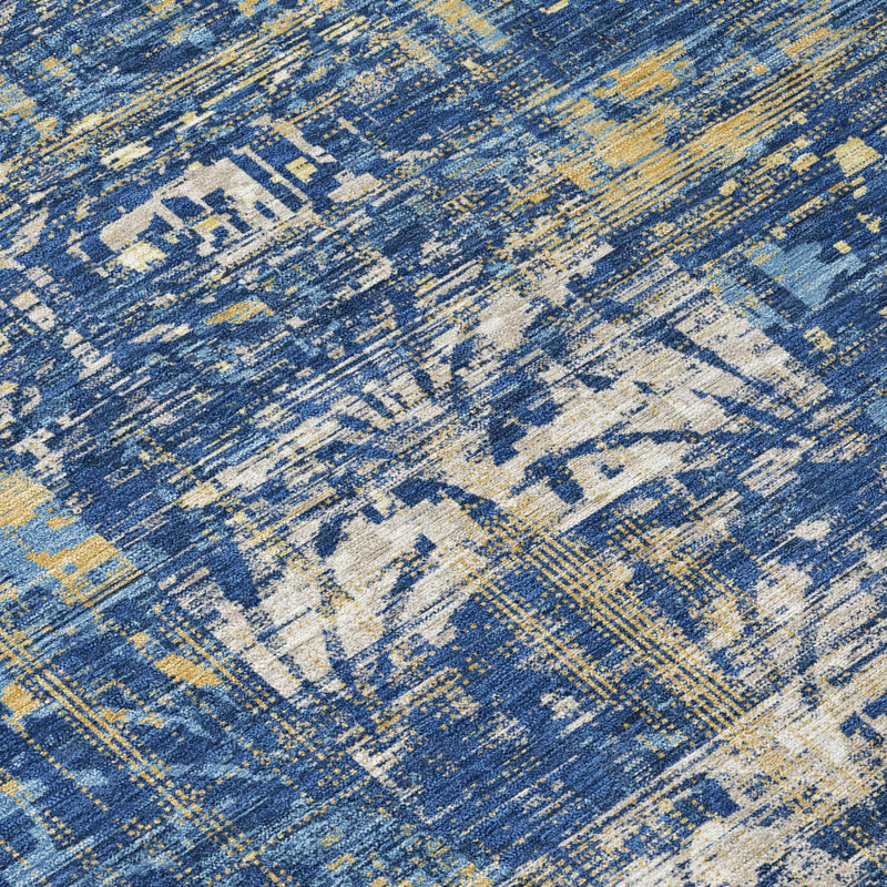 Round rug close-up: blue and navy distressed abstract pattern with cream highlights