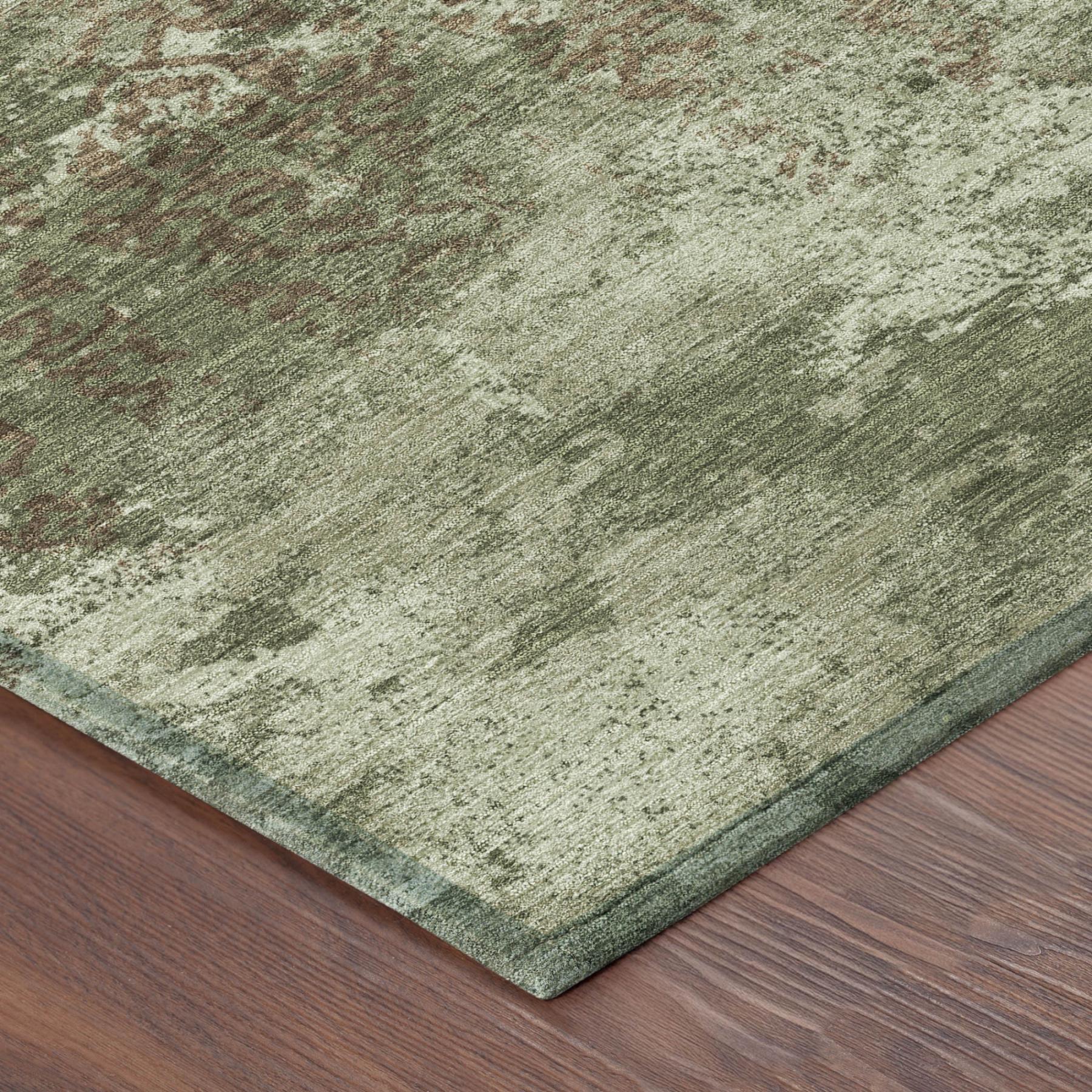Olive green abstract area rug corner detail with short woven texture and dark edge