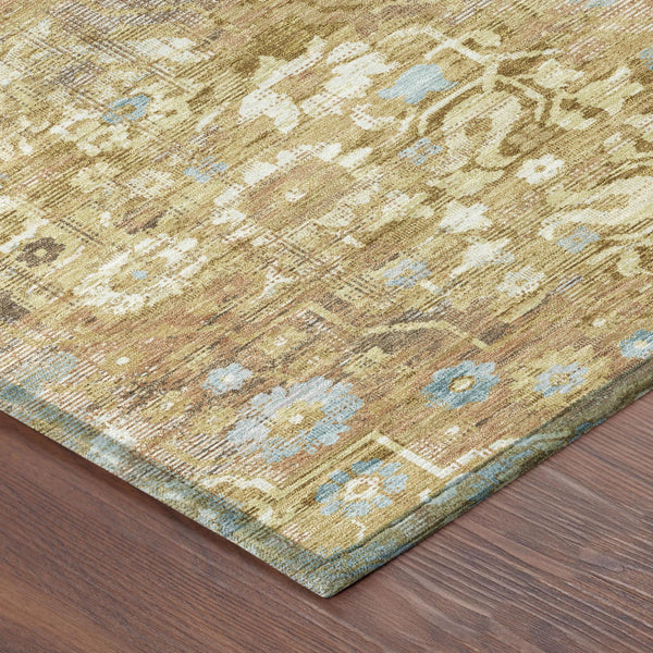 Corner detail of round area rug with gold, copper, and light blue distressed pattern