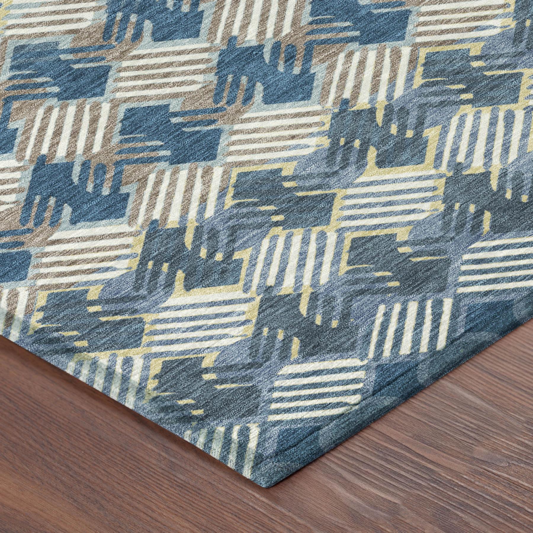 Corner view of blue and cream geometric stripe area rug with textured edge