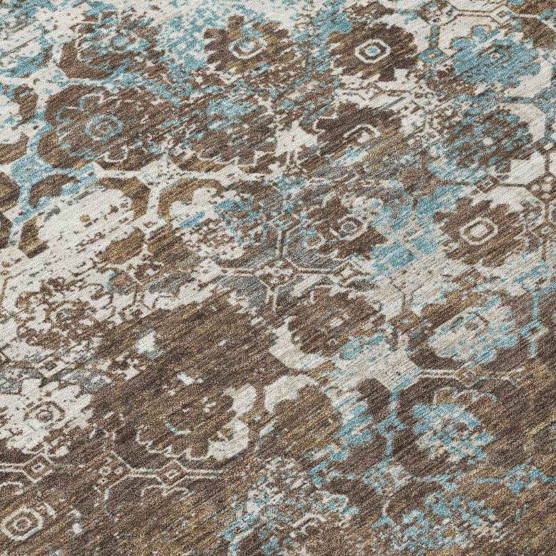Brown and cream area rug with blue floral medallion geometric details.